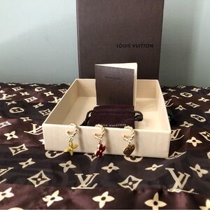 Louis Vuitton 3 Piece Gold Tone Heart, Red Enamel and Yellow Charm Earrings.